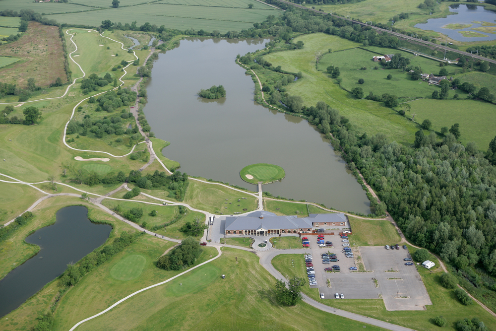 Aerial view of the clubhouse overlooking the 18th green and Fishing lake