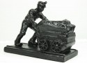 coal miner pushing tram
