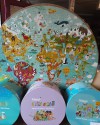 May be an image of indoor and text that says "boppi Round Puzzles 150 pieces"