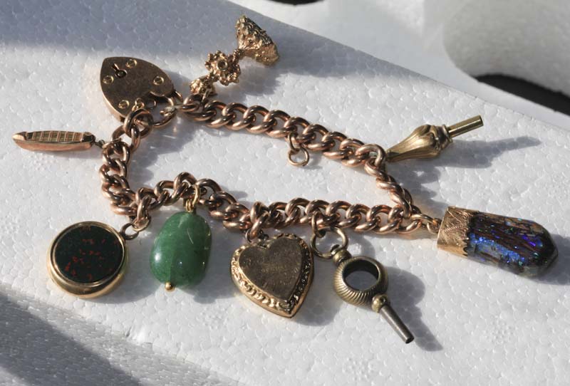 Bracelet 9 ct charm 8 charms 44 gm c1920