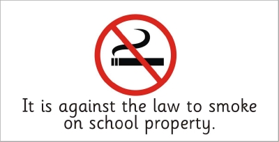 SAFETY SIGN - IT IS AGAINST THE LAW TO SMOKE ON SCHOOL PROPERTY