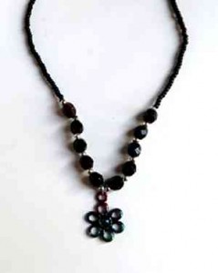 black flower and bead necklace,